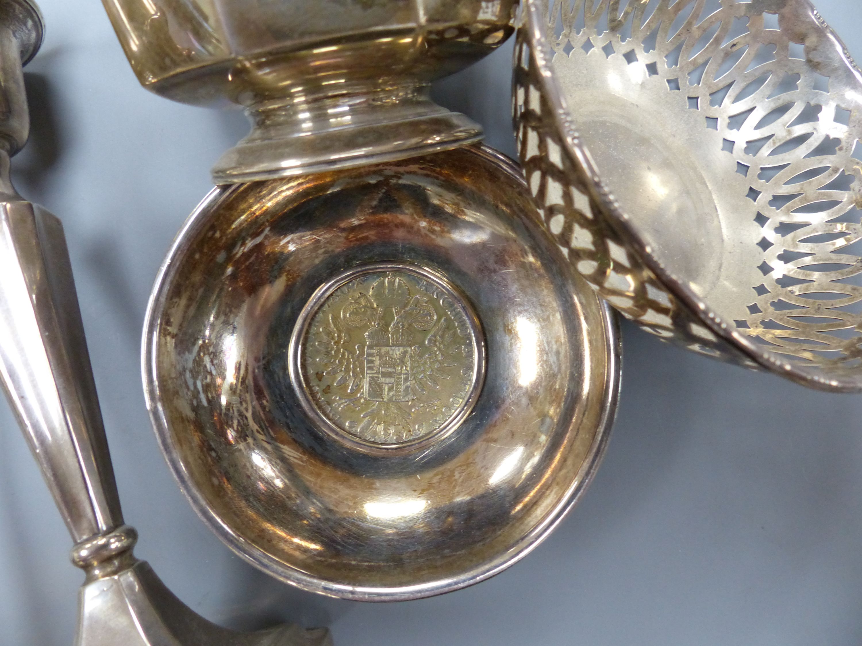 A pair of George V silver mounted candlesticks, 15.2cm, a silver posy vase, silver bowl, silver pierced dish and a 925 inset coin dish.